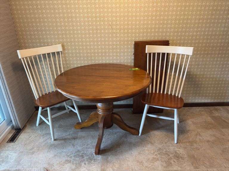 42” round dining table w 18” leaf and two chairs