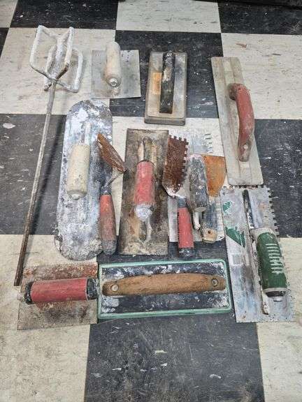 Assorted concrete and tile trowels image