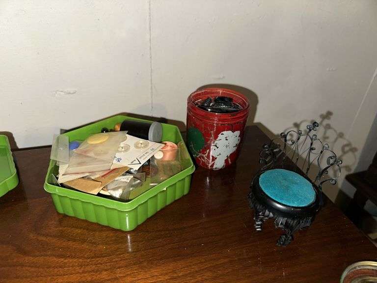 Sewing machine cabinet and notions
