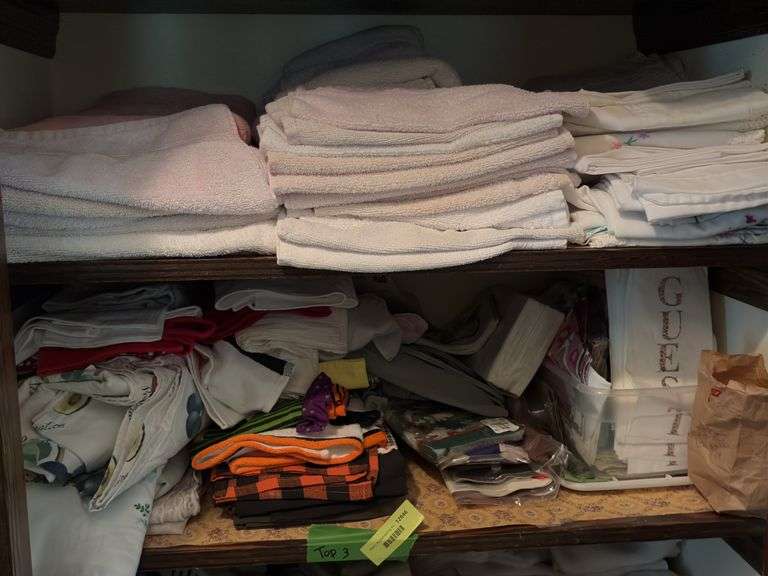 Top 3 shelves includes blankets, towels, hand towels, etc
