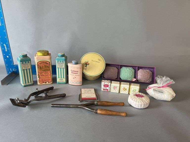 Dresser accessories include antique curling iron, hair trimmers, small mirror w/ Wisconsin advertising image