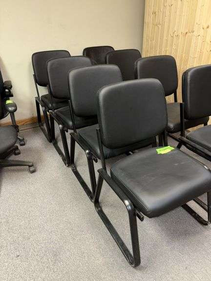 Four matching stationary office chairs image