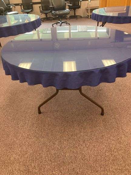 60” Round folding table with glass top and blue tablecloth image