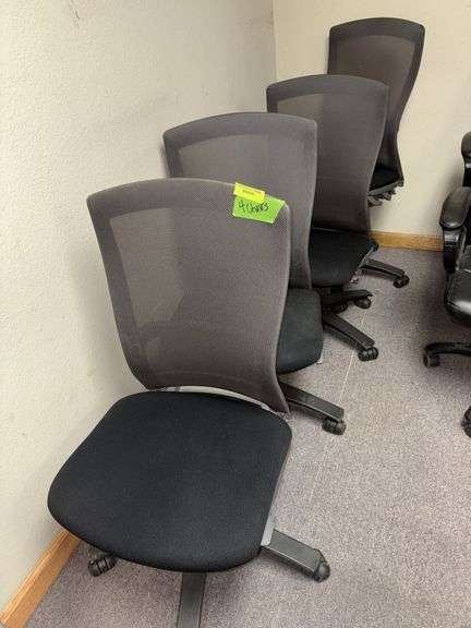 Four adjustable height matching office chairs image
