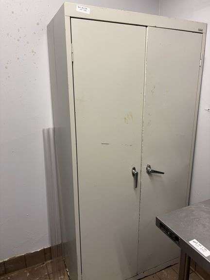 Metal storage cabinet 36x18x72 with some rusting at bottom image