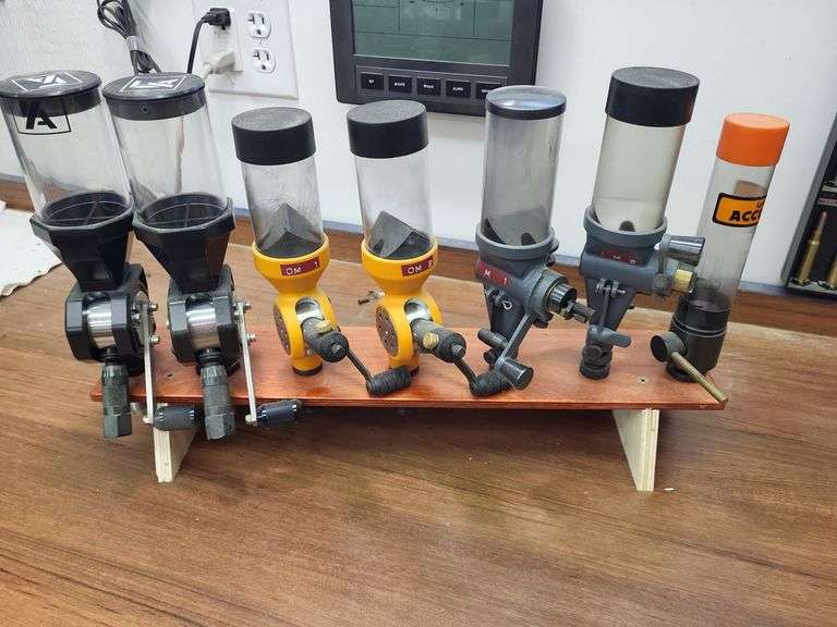 Powder measure set on wood stand Lyman image