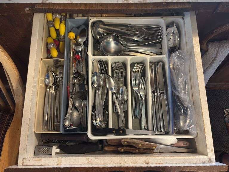 Large set of community, stainless flatware, and lots of extra kitchen utensil items image