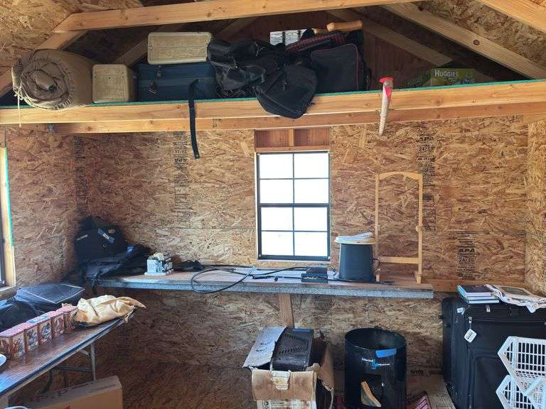 Remaining contents of shed includes lots of luggage, snowmobile bags, some collectible items, kerosene heater, charbroil smoker image