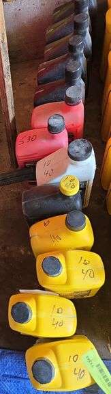 Misc car fluids includes 10-40, 5-30, power steering fluid, brake fluid, etc image