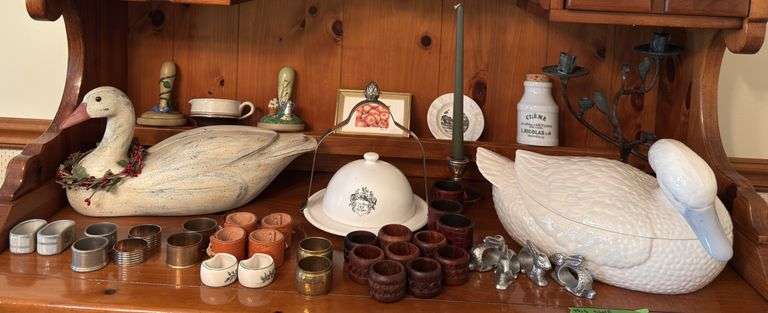 Many napkin rings, large goose soup tureen, goose decoy and other decor image