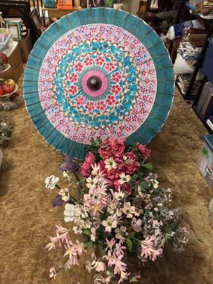 Flower in vases including three glass flowers and a paper umbrella image