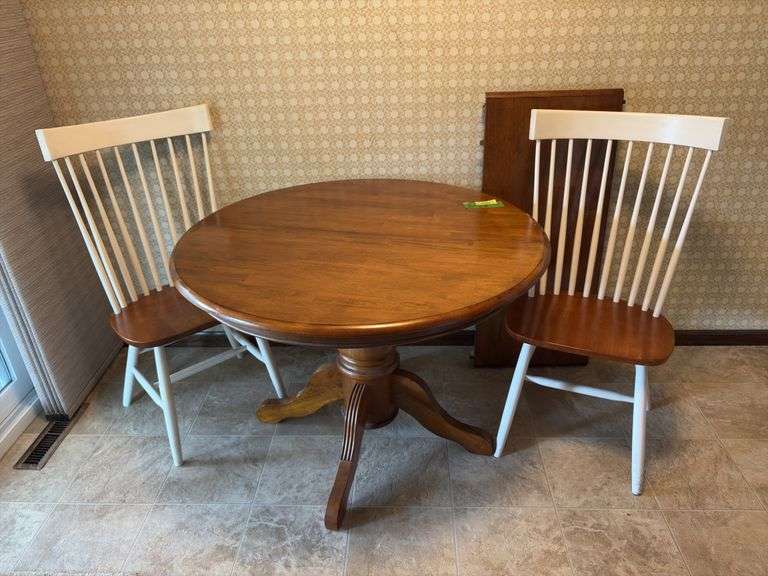 42” round dining table w 18” leaf and two chairs image