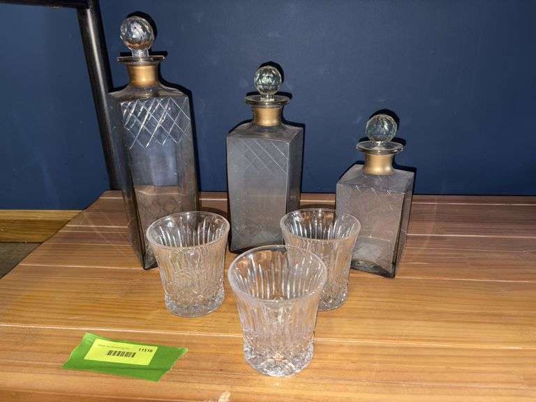 Three decanters and a glass for each one image