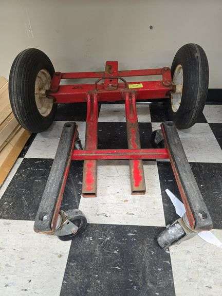 Steel mover [hot tub?] and set of steerable pneumatic wheels image