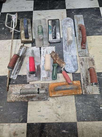 Assorted concrete and tile trowels image