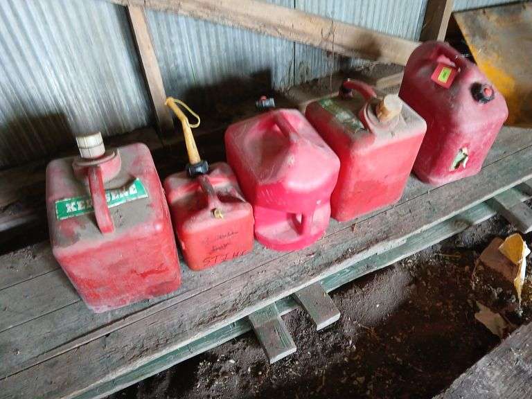 Kerosene and gas cans most are full image