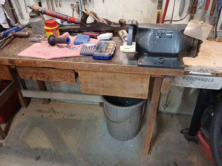 Contents on and in workbench, bench vise, bench grinder, elec drill, bench plane, brace and bits etc... image