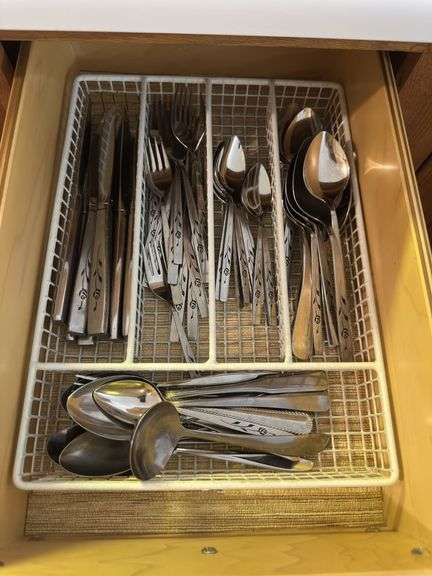 4 kitchen drawers marked "A" with flatware and kitchen utensils