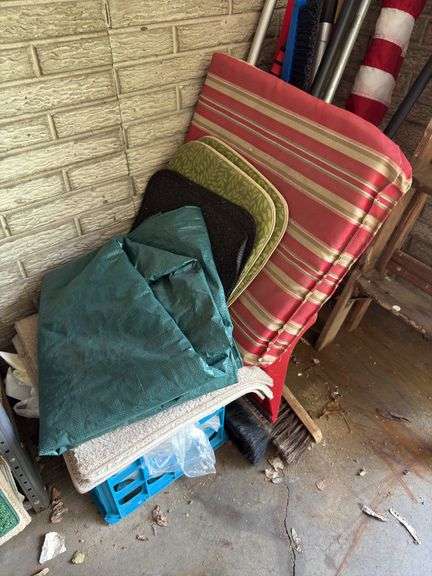 In corner includes US flag, trap, chair cushions, window scrapers , yard tools, 5’ wooden painters ladder