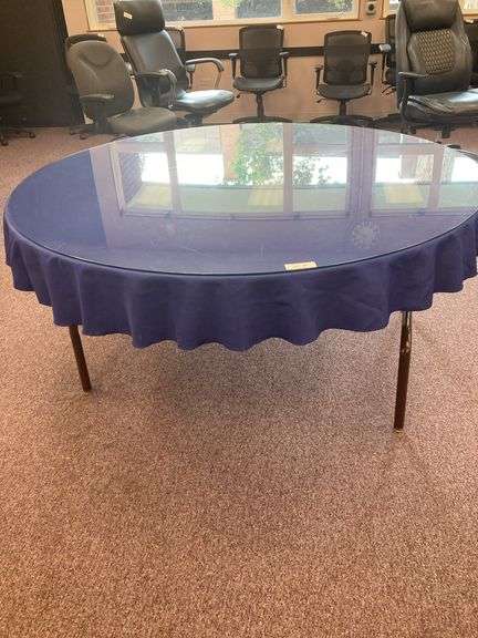 60” Round folding table with glass top and blue tablecloth image