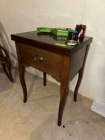 Sewing machine cabinet and notions