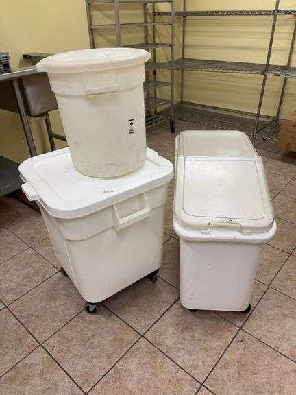 Three plastic storage white bins on rollers  (sorry you will have to dump flour) image