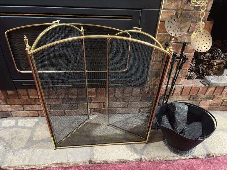 Bucket of coal, fireplace tools, fireplace screen and brass decor image