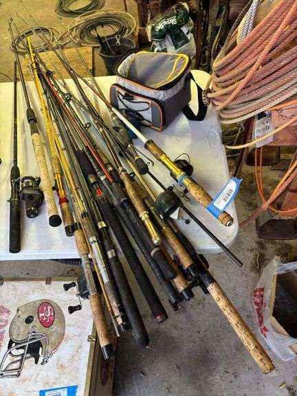 Large lot of fishing poles and small cooler image