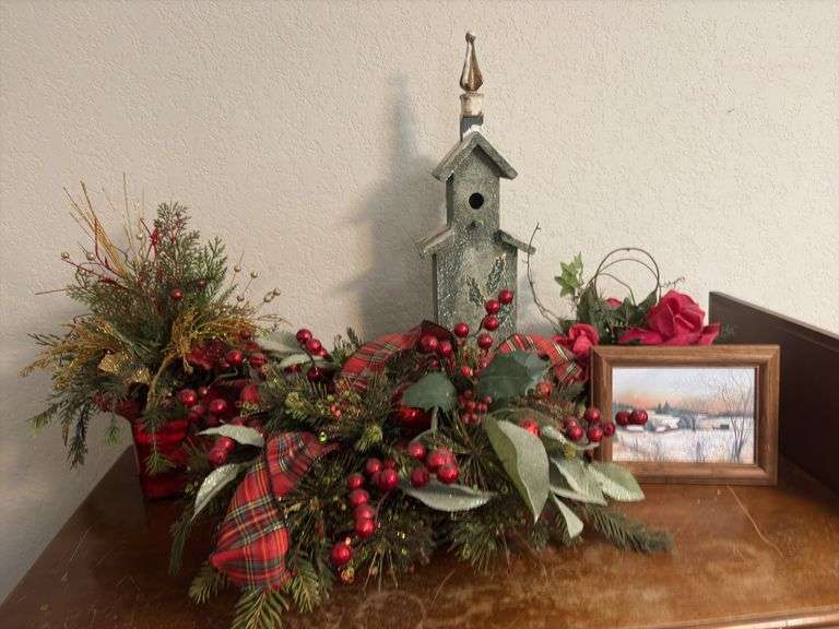 Contents of dresser include holiday decor, wrapping paper, tissue paper, ribbon and bags