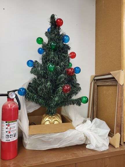 Christmas tree and fire extinguisher with picture frames image