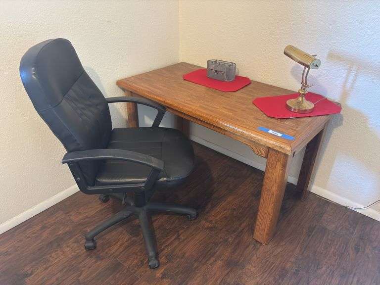 Wood library table/desk and black rolling desk chair with brass desk lamp image