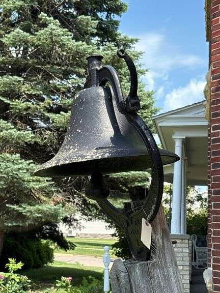 Cast iron dinner bell “Bell 2”  American Foundry Co. come prepared to take it down. 26” at base. With large clapper and yoke image