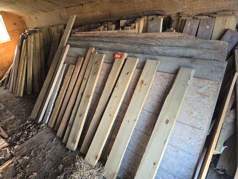 LG qty of 4' dimension lumber mostly wolmanized north half of shed image