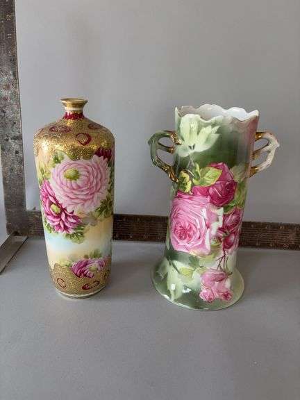 Two hand painted vases with floral design image