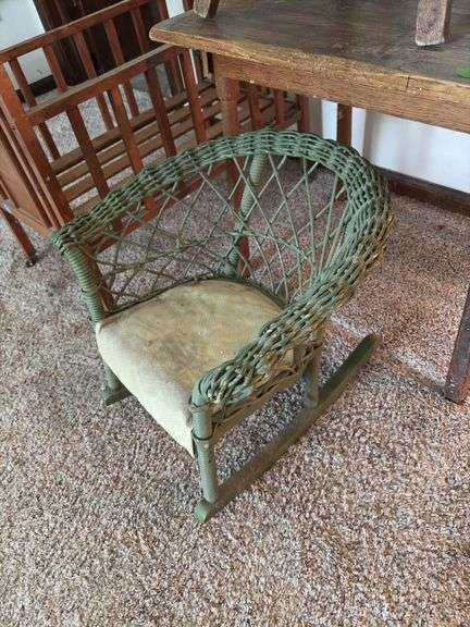 Doll crib, green wicker doll rocker, child’s table and chair