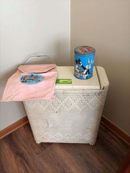 Wicker hamper, vinyl clothes pin hanger and Looney Tunes tin image