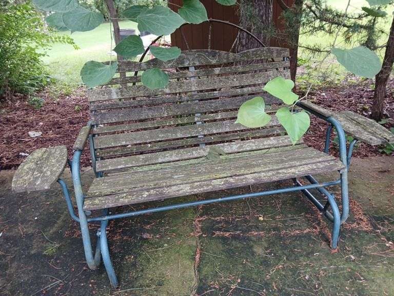 44" steel wheel, 48" glider bench that needs powerwashing image