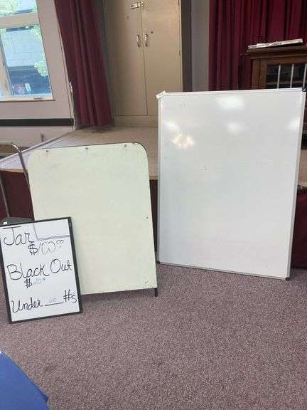 Three white boards, one is an easel image