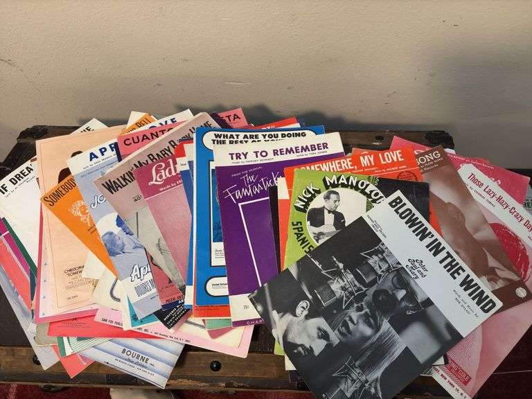 Sheet music and variety of music books, music stand