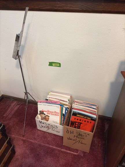 Sheet music and variety of music books, music stand image