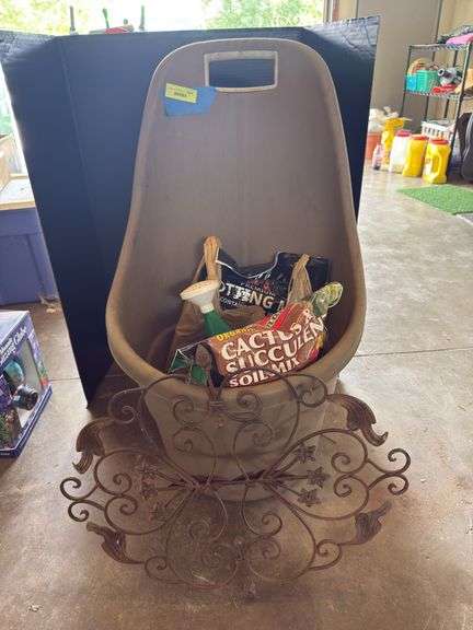 Yard cart, potting soils, plastic water can and decorative art image