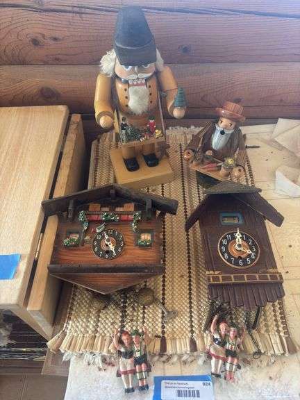 Two cuckoo clocks and Nutcracker plus wooden cut out gardener man image