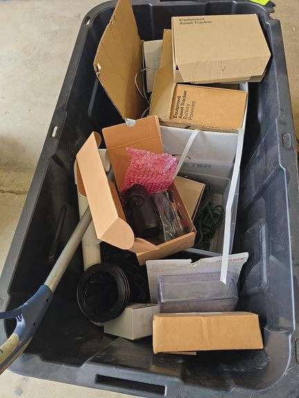 Tote w/ assorted items includes 4 boxes of equipment asset trackers, Verizon connect camera, thermostat cover, rebar chairs image