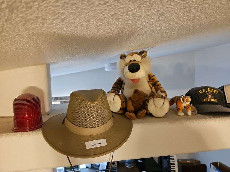 Hats, Stuffed Animals, Red Glass Piece