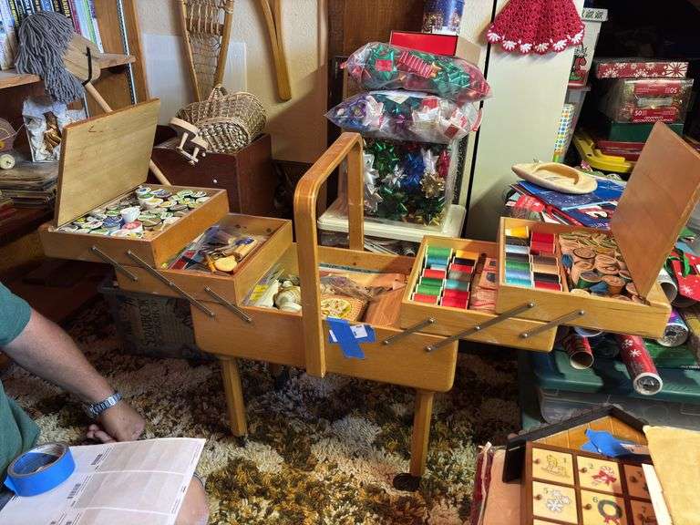 Large expanding sewing box on casters completely full of sewing notions image