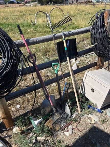 Assorted yard tools and Suncast hose reel image