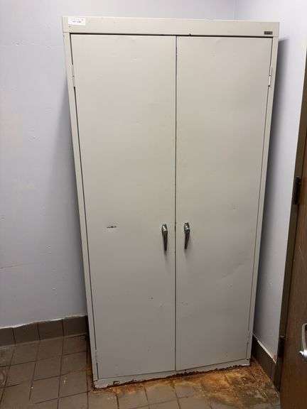 Metal storage cabinet 36x18x72, rust at bottom image