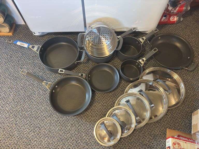 Set of seven Kirkland signature series nonstick cooking pans with five lids image