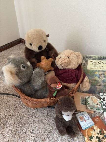 Children’s books and a basket of stuffies