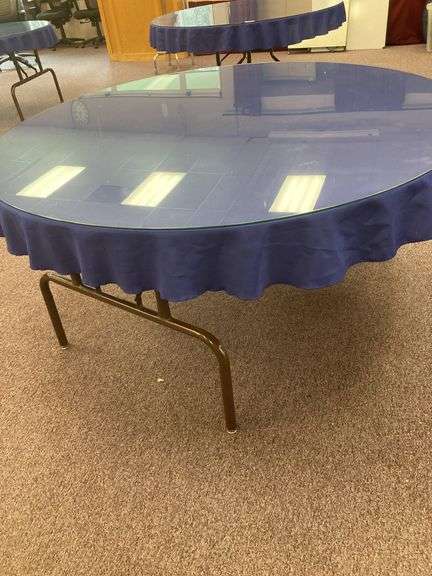 60” Round folding table with glass top and blue tablecloth image